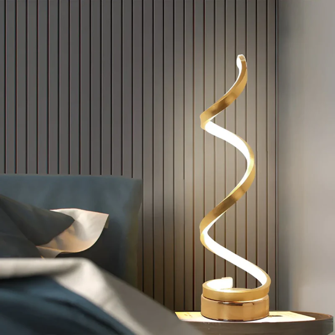 Energy-efficient modern spiral LED desk lamp, dimmable, provides comfortable ambient lighting.