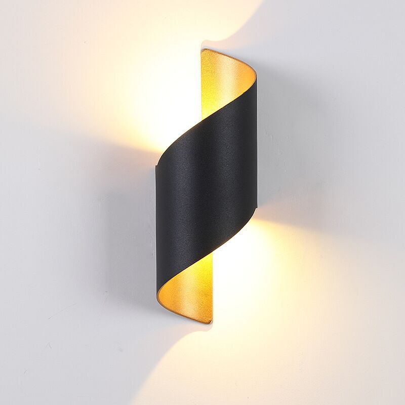 Modern spiral LED garden wall light, creating inviting outdoor ambiance.