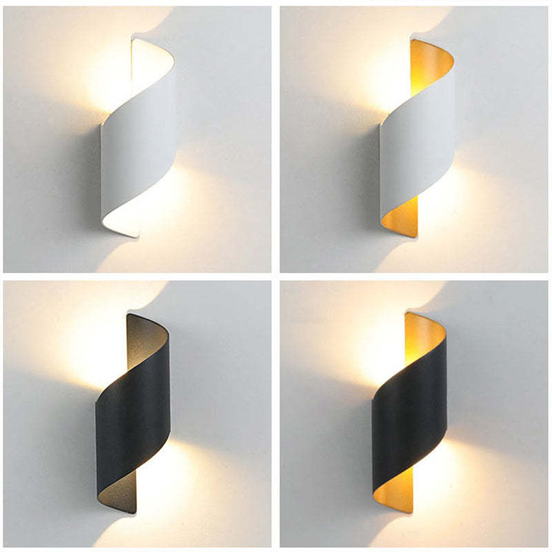 Contemporary spiral LED lamp, ideal for modern interior wall lighting.