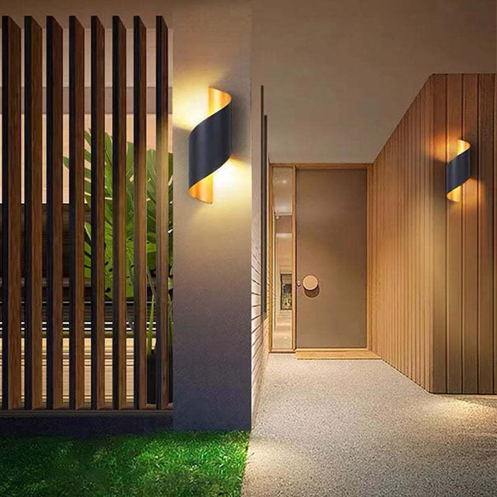 Durable spiral LED wall lamp for garden and outdoor accent lighting.