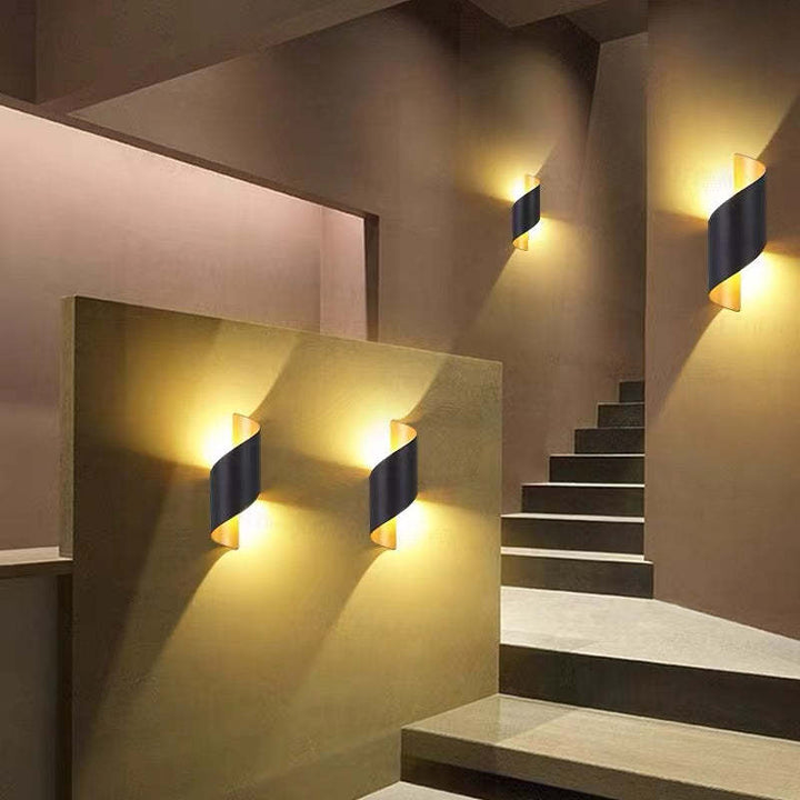 Decorative spiral LED wall sconce for modern home & garden lighting.