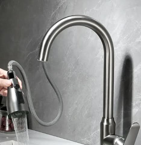 Versatile stainless steel touch kitchen faucet with pull-out spray head & single lever control for modern kitchens.