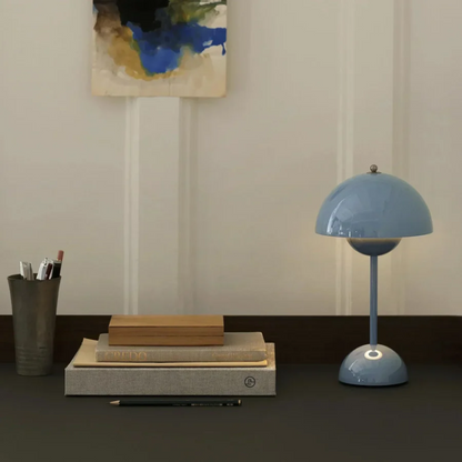 Minimalist modern touch lamp with soft, adjustable LED light for reading.