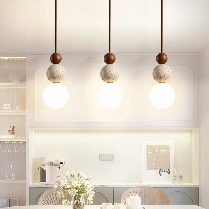 Modern natural aesthetic pendant light with travertine and mahogany; contemporary home decor ceiling fixture.