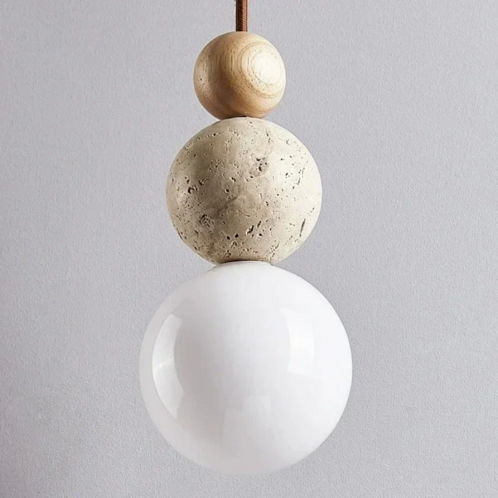 Beautiful modern pendant light crafted from natural travertine and mahogany, enhancing contemporary home decor.