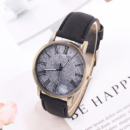 Bronze case unisex wristwatch with a blue denim strap, embodying modern street style and a casual fashion aesthetic.