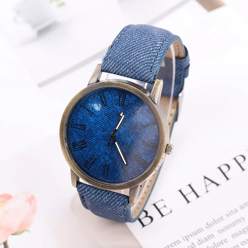 Unisex fashion watch with a distinctive denim strap and elegant bronze case, embodying modern Tokyo street style.
