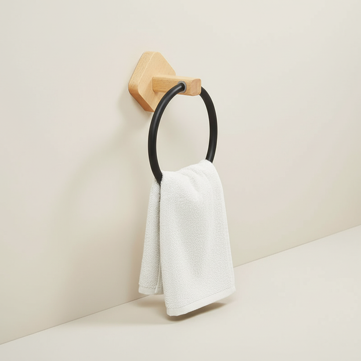 Minimalist wall towel holder with a natural wood ring and sturdy aluminum bracket. Enhances modern home decor.