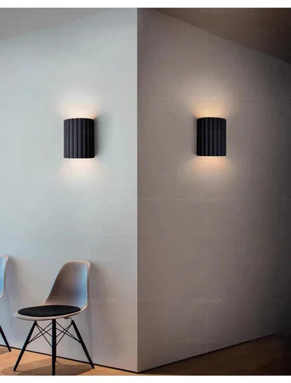 Decorative wavy LED wall light, adds modern ambiance to bedroom, hallway, or office spaces.