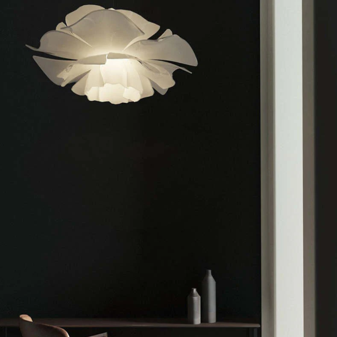 Adjustable white metal flower pendant lamp. Versatile modern lighting, perfect for bedrooms & dining.