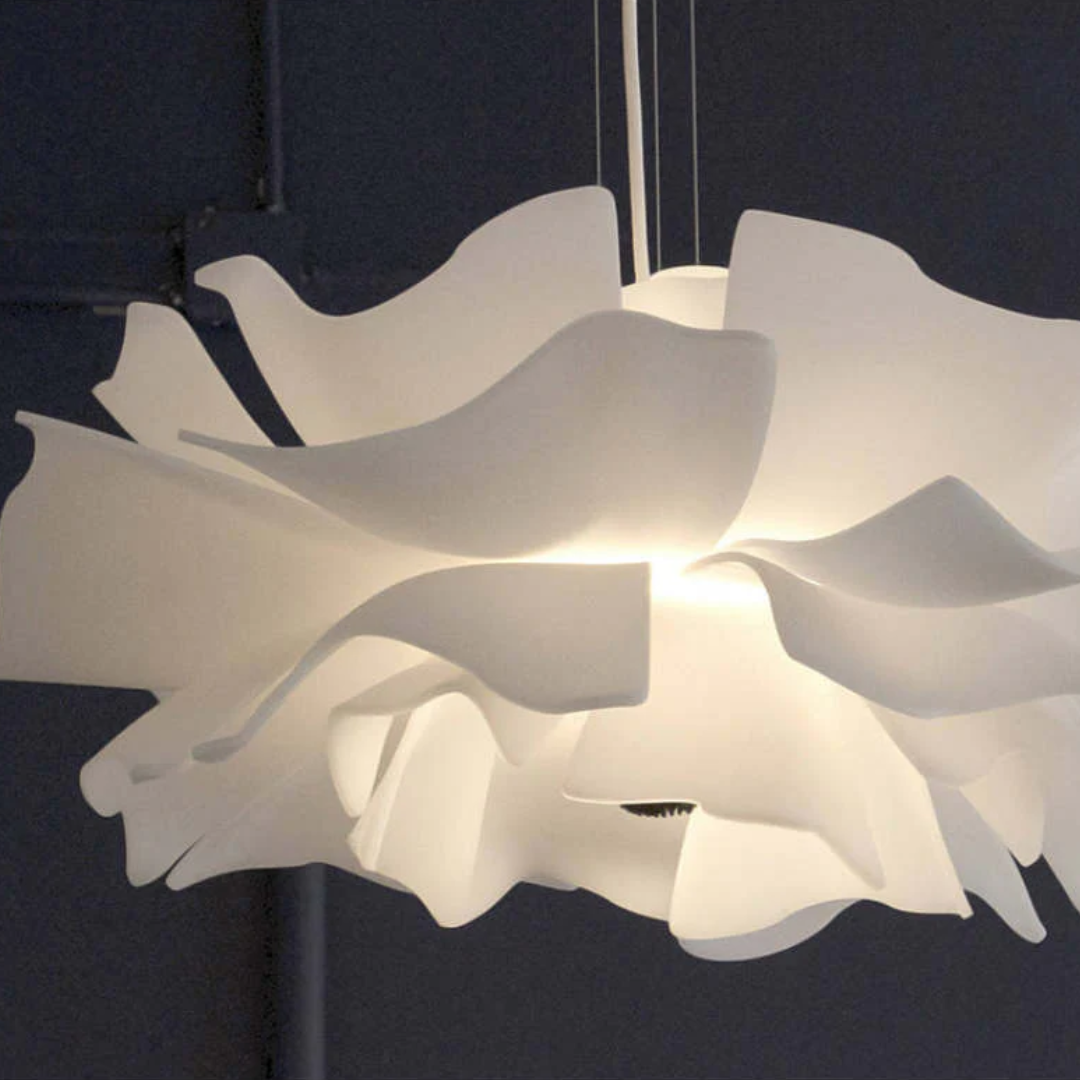 Minimalist white metal flower pendant lamp. Clean, modern ceiling light for contemporary home decor.