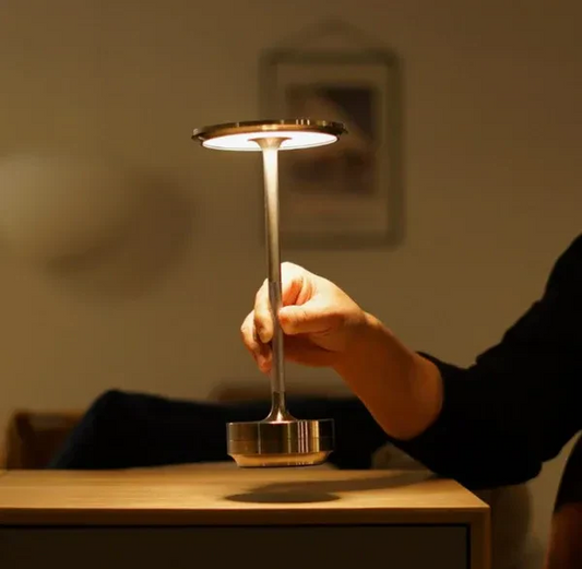 Modern wireless dimmable rechargeable LED desk lamp for home, office, or outdoor use. Elegant aluminum portable light.