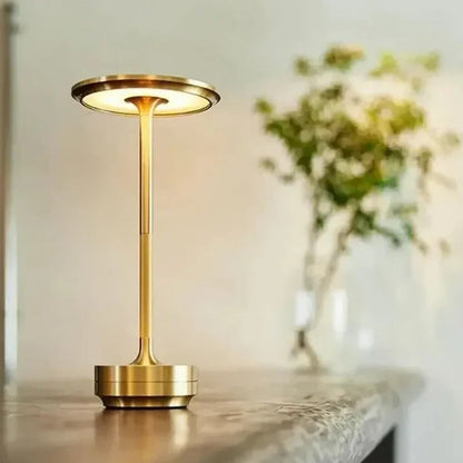 Portable rechargeable LED table lamp provides versatile wireless lighting for outdoor dining or cozy indoor ambiance.