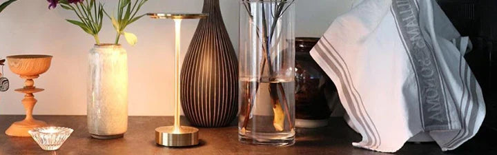 Waterproof portable rechargeable LED table lamp. Versatile indoor/outdoor lighting, ideal for patio or desk.