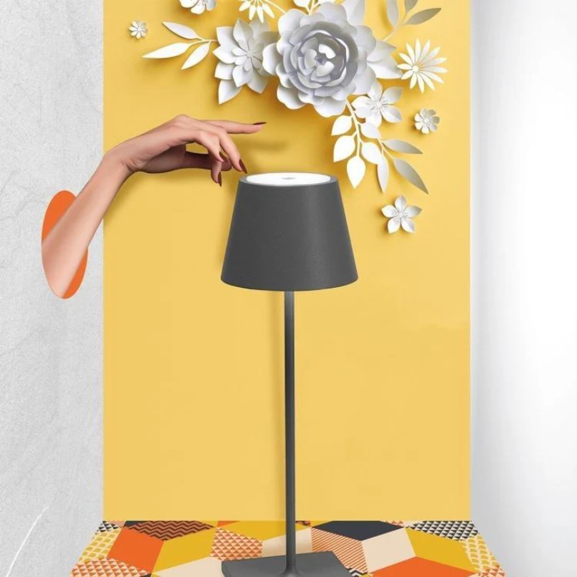 Modern wireless LED table lamp for ambiance & desk. Touch-sensitive & rechargeable.