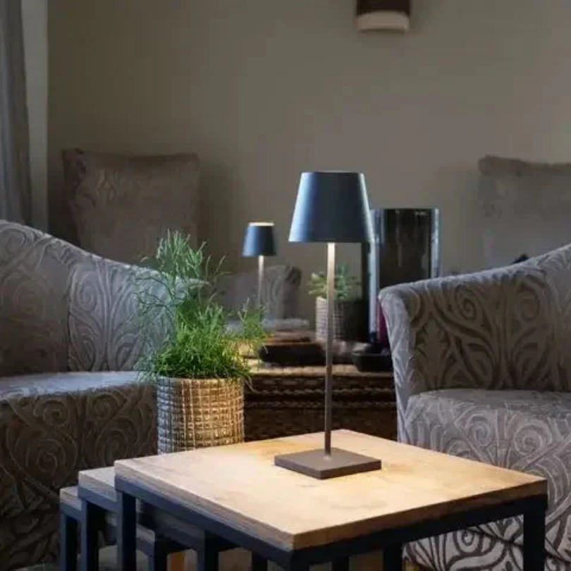 Rechargeable LED lamp with touch control, perfect for modern desk lighting.