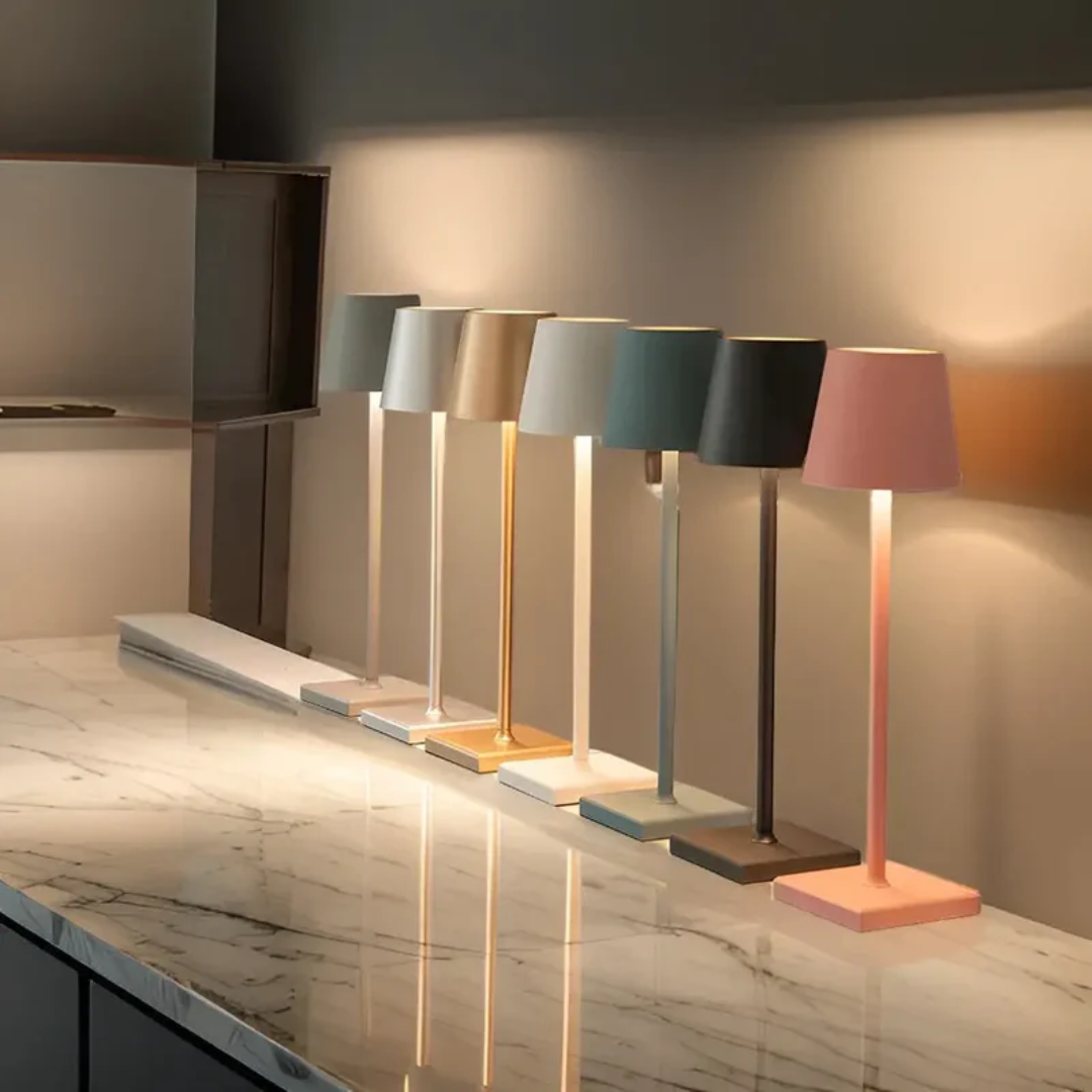 Contemporary wireless LED table lamp, dimmable with touch control, adds modern flair & light.