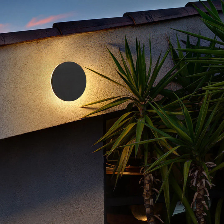 Minimalist Zenith LED sconce, enhances modern facades and interior passages.