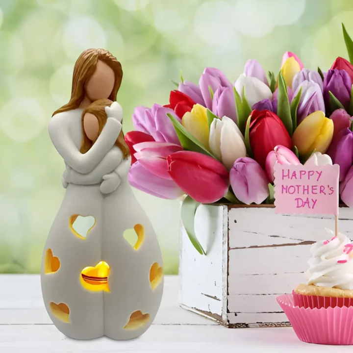 Ceramic mother daughter candle holder, depicting a loving embrace, perfect as a unique Mothers Day gift.