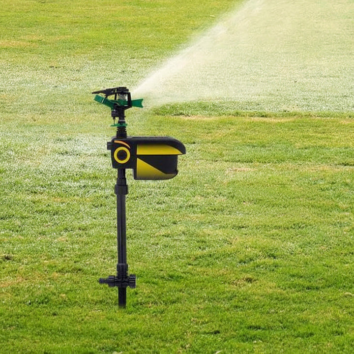 Motion-activated animal repellent sprinkler protecting a lush garden. Effective deer, cat, & dog deterrent.
