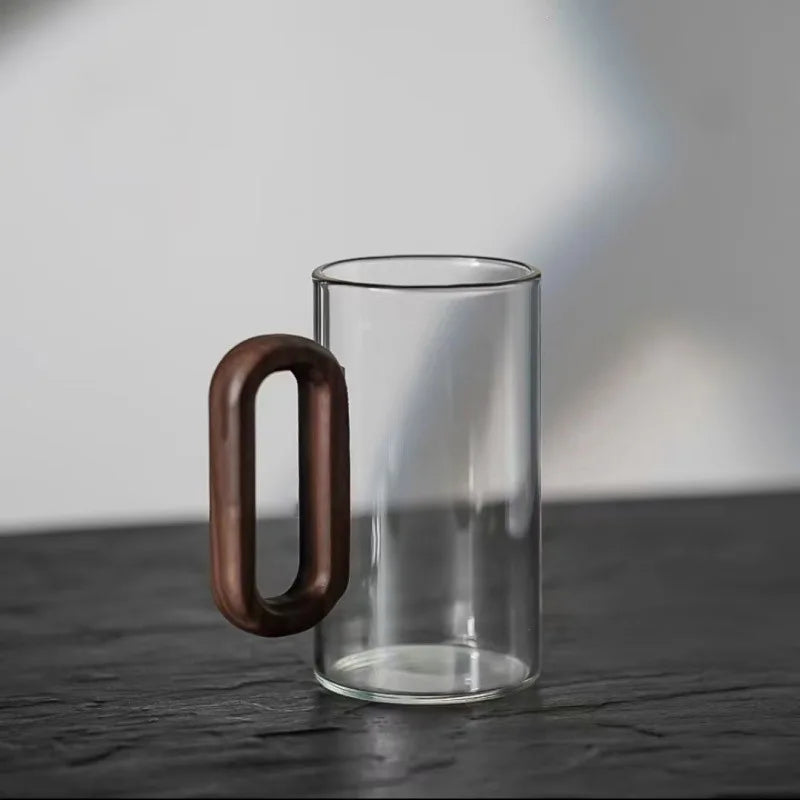 Elegant borosilicate glass tea mug with etched mountain design. Durable, clear drinkware for hot beverages.