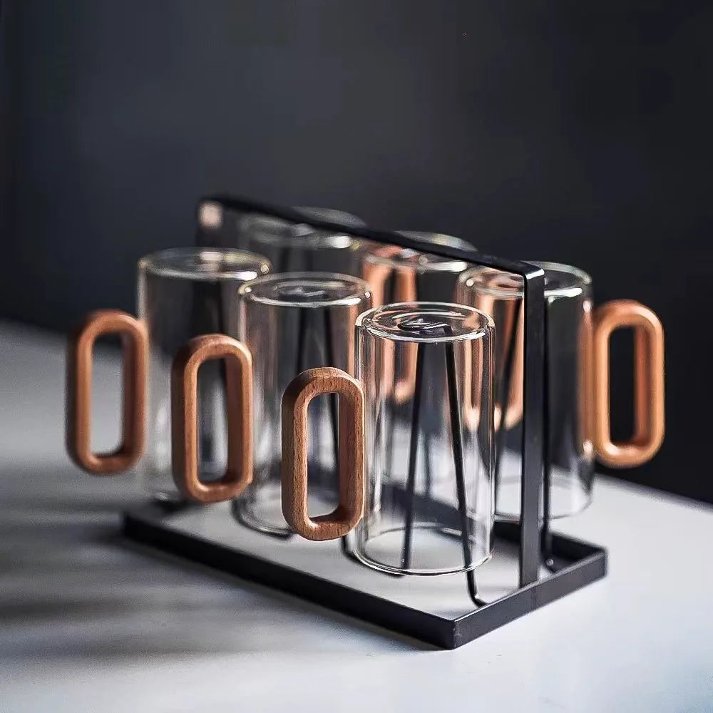 Borosilicate glass coffee & tea mug showcasing a detailed mountain base. Alpine design, stylish drinkware.