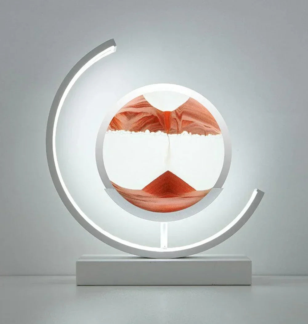 Ethereal Moving Sand Art Lamp, generating calming landscapes with integrated ambient lighting for tranquility.