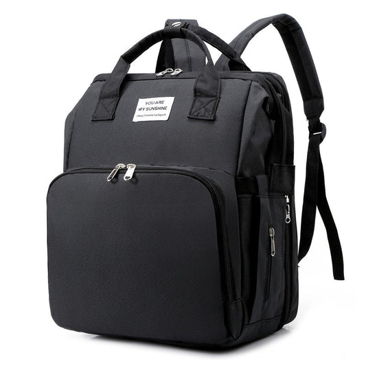Multi-function portable baby bed & diaper bag travel backpack for parents on the go.