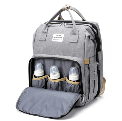 Organized storage in a baby travel backpack with a fold-out portable bed & changing area.