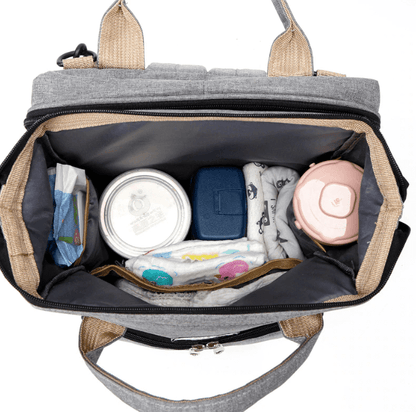 Easy-to-use portable baby bed and diaper bag, folds into a travel backpack for parents.
