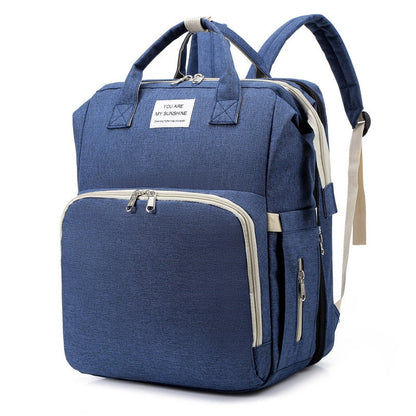 Convenient changing station and nappy bag built into a stylish travel backpack.