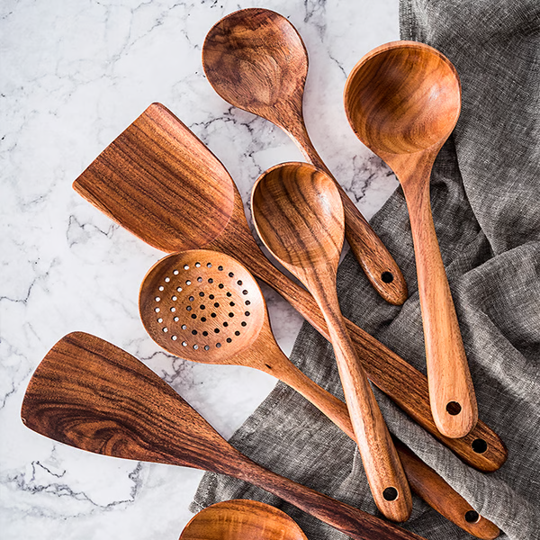 Natural teak wood kitchen utensil set, eco-friendly & non-toxic cooking spoons for home use.