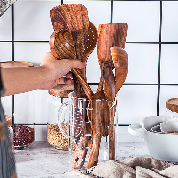 Eco-friendly natural teak wood kitchen utensil set, non-toxic & sustainable cooking gadgets.