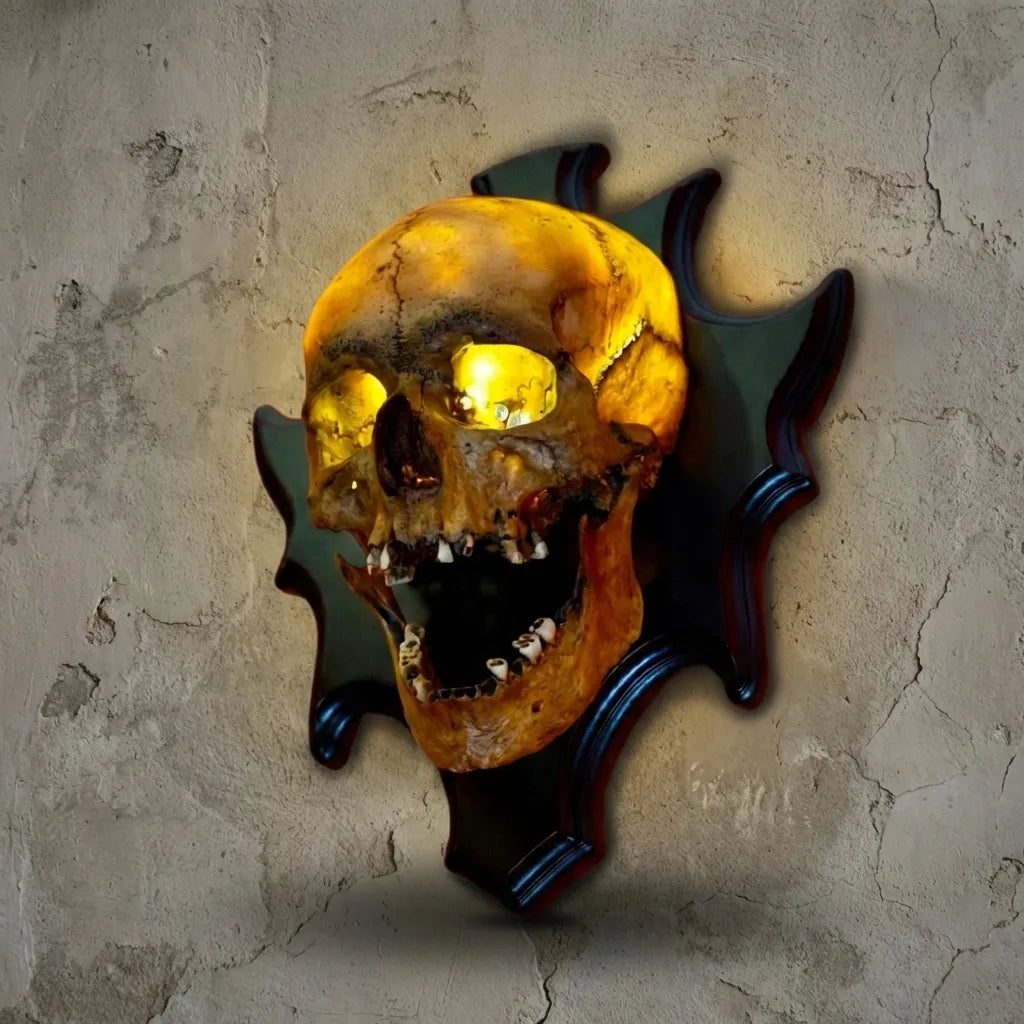 Resin skull lamp, wall mounted Nocturiskull, adds spooky ambiance to gothic or Halloween wall decor.