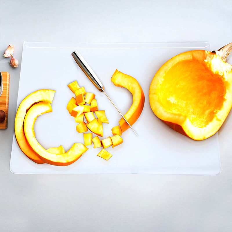 Stylish transparent acrylic cutting board, non-slip base for safe slicing & elegant kitchen display. Ideal for serving.