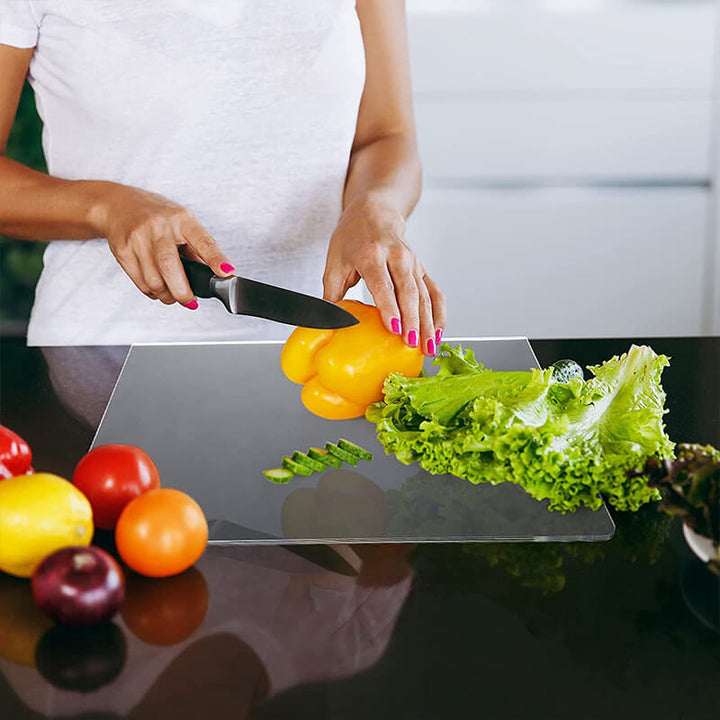 Secure non-slip acrylic cutting and serving board. Transparent, hygienic design for safe food prep in modern kitchens.