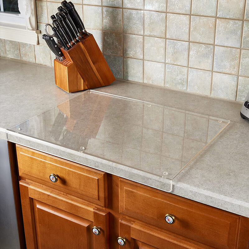 Durable non-slip acrylic cutting board for stable and safe kitchen food prep. Transparent design fits any modern home.