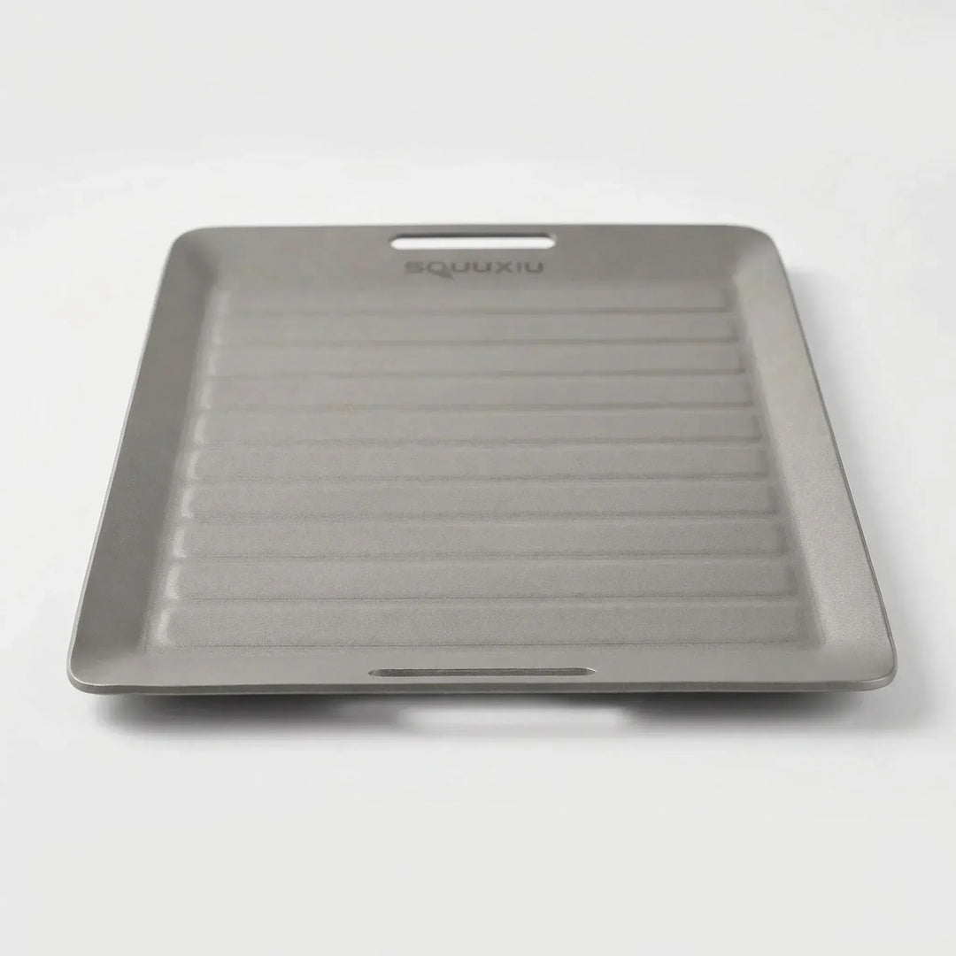 Portable camping grill plate & BBQ tongs set for outdoor cooking. Non-stick, ideal for hiking and camp kitchen.