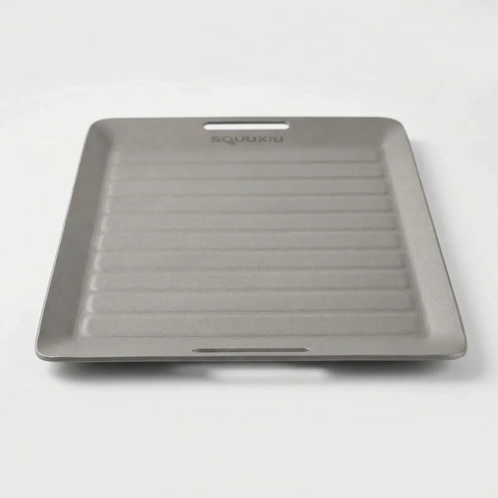 Portable camping grill plate & BBQ tongs set for outdoor cooking. Non-stick, ideal for hiking and camp kitchen.