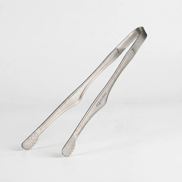 Versatile camping grill plate and tongs set for outdoor cooking. Portable, non-stick, perfect for hiking adventures.