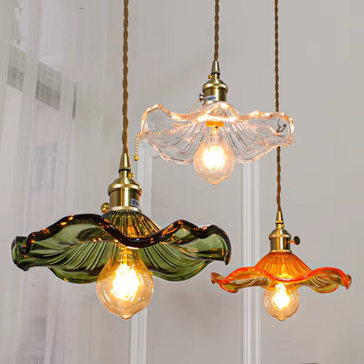 Nordic LED pendant lamp with clear glass shade & copper accents. Modern home decor for living room.