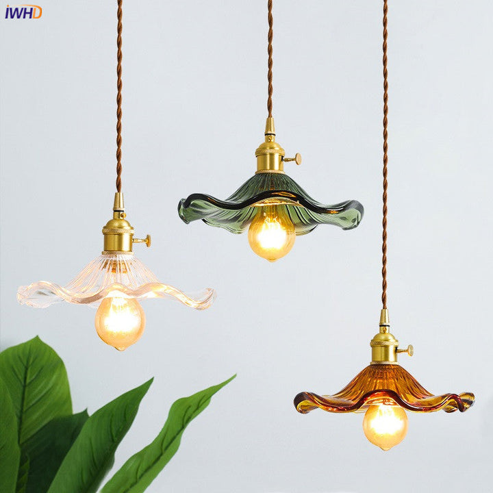 Beautiful Nordic LED pendant light, blue glass & copper. Enhances living room with unique design.