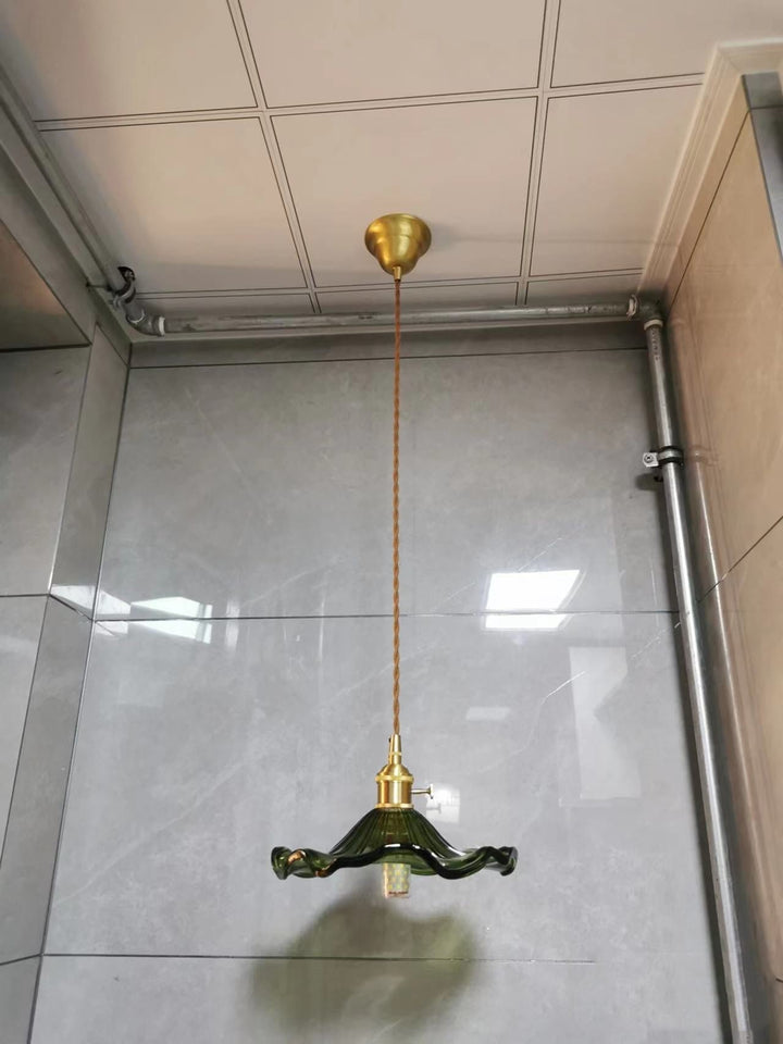 Modern Nordic LED hanging lamp, green glass & copper. Stylish lighting for a creative space.