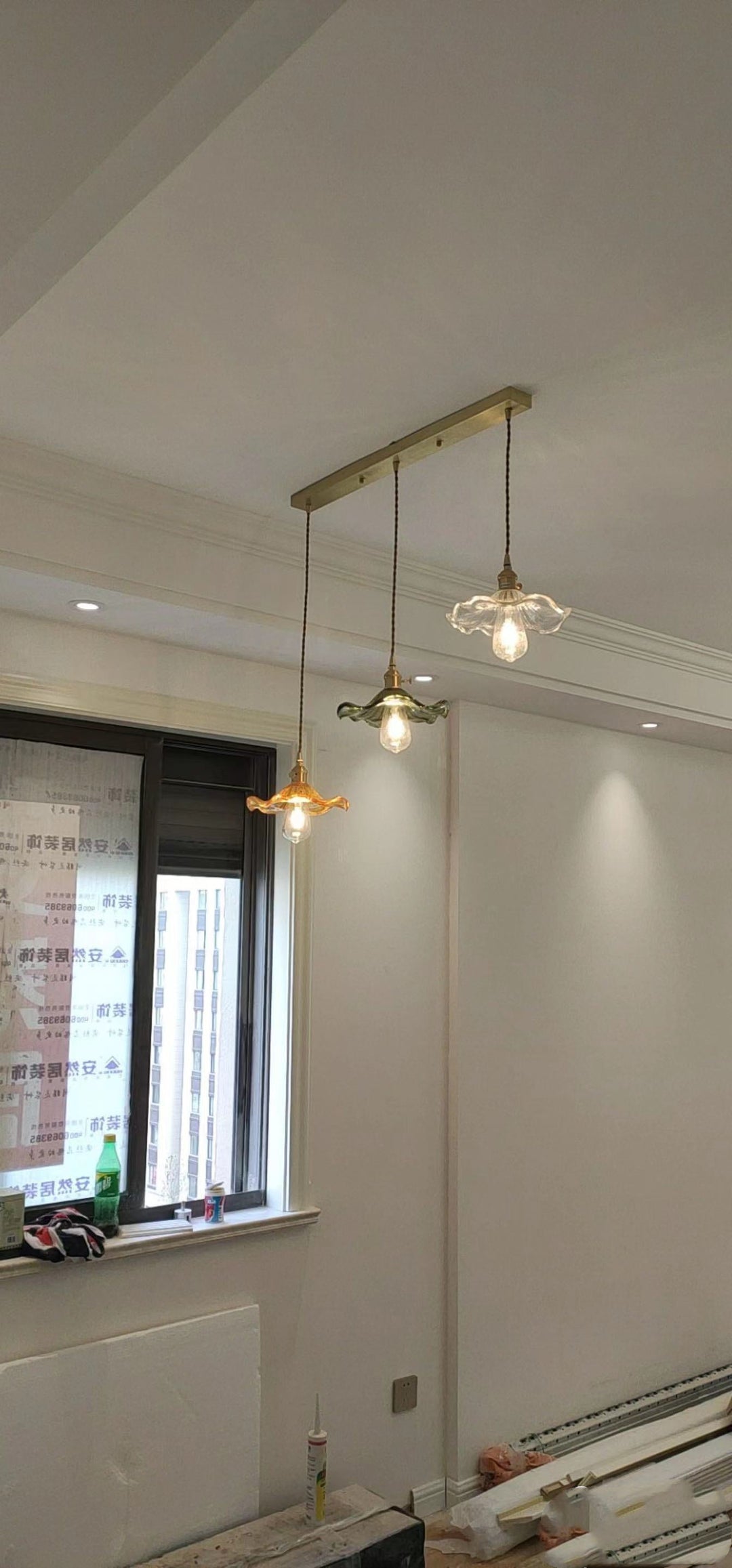 Nordic design LED hanging lamp, clear glass & copper. Brightens up a kitchen island.