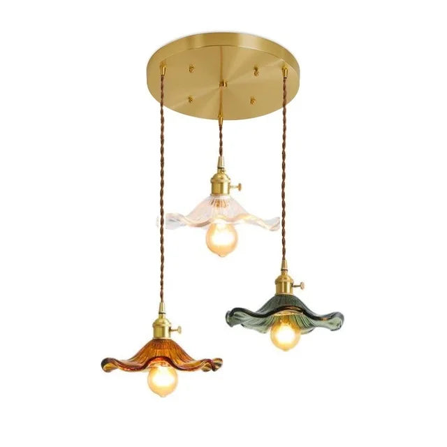 Modern Nordic LED pendant, amber glass & copper. Warm light for a cozy bedroom.