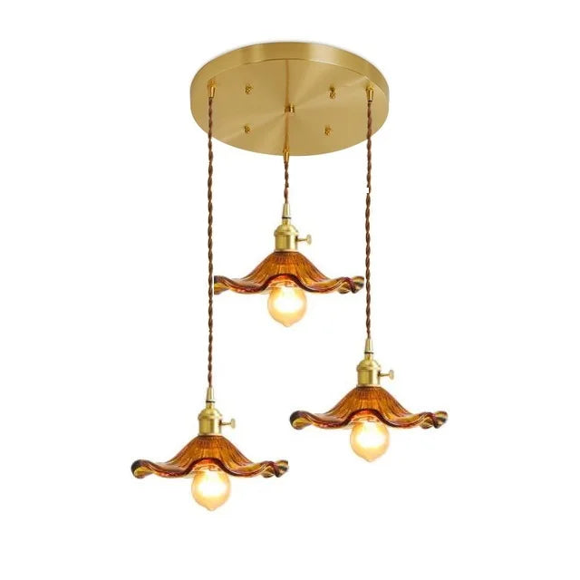 Nordic LED pendant light, blue glass & copper. Unique decor for a modern dining area.