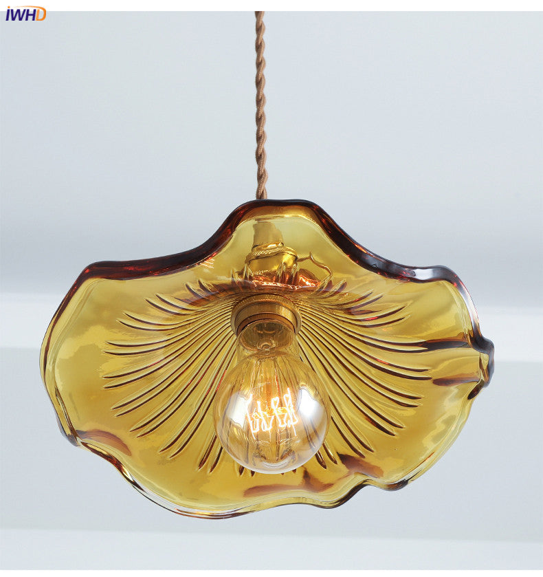 Decorative Nordic LED pendant, green glass & copper finish. Enhances any modern living space.