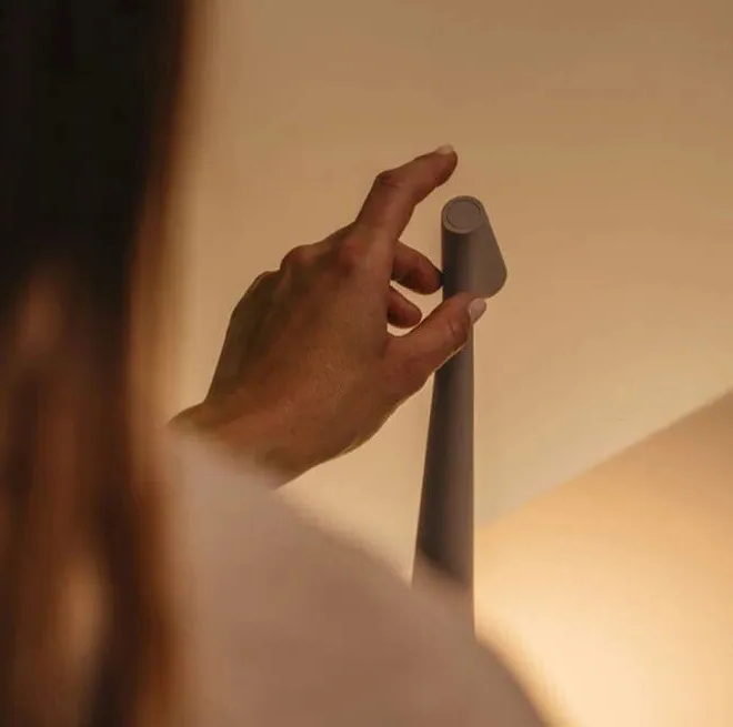 Sleek Nordic wireless LED reading lamp. Portable modern design, perfect for comfortable evening ambiance.