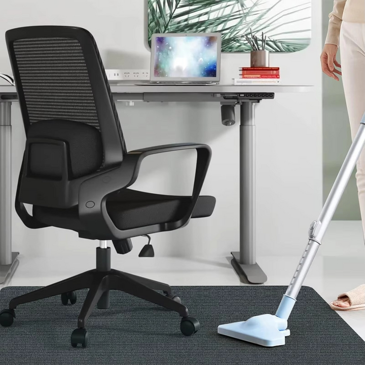 Clear office chair mat, a floor protector for carpets. Guards hardwood floors from desk chair wheels.