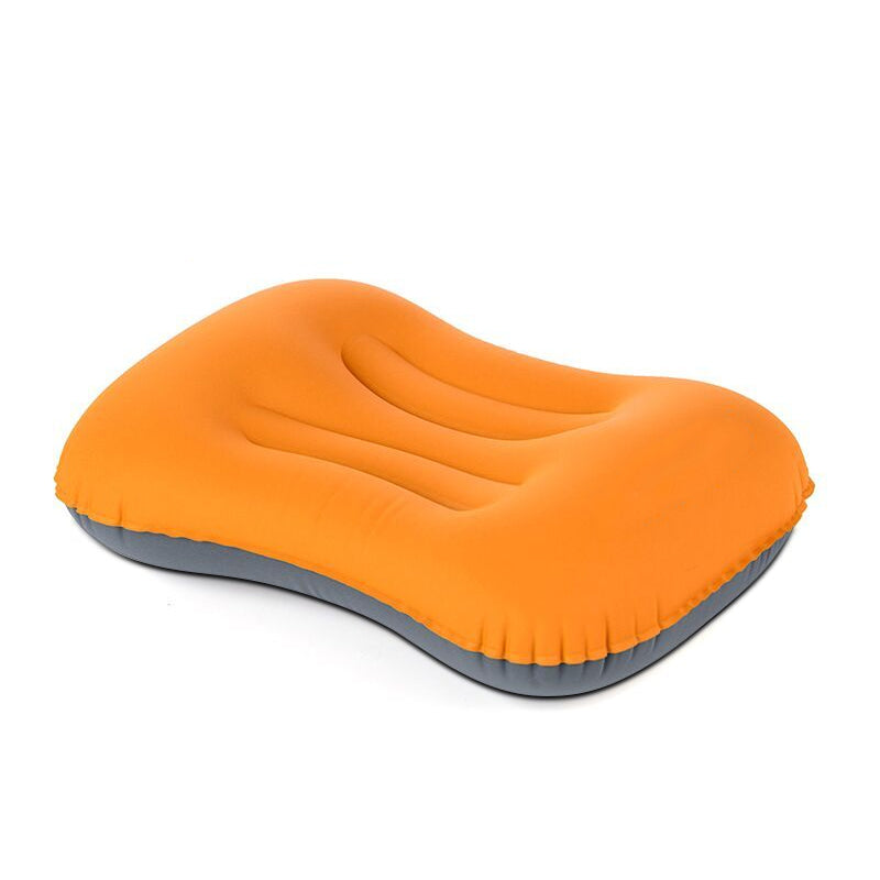 Apple green outdoor air pillow, inflatable for backpacking, provides essential neck support on trails